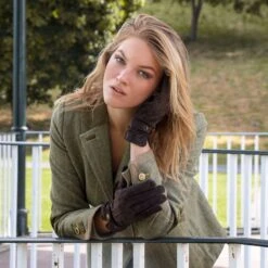 Women's Touchscreen Water-Resistant Three-Point Fleece-Lined Suede Gloves -Dents woman wearing brown suede gloves