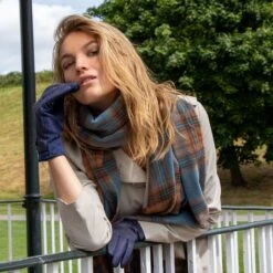 Women’s Touchscreen Velour-Lined Faux Suede Gloves With Dogtooth Print -Dents woman wearing navy houndstooth gloves